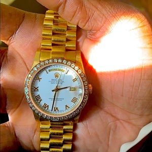 Rolex oyster-perpetual day date watch.